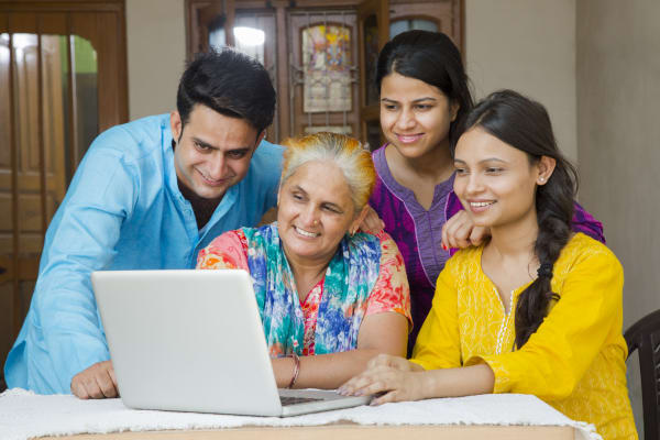 Family sitting around computer